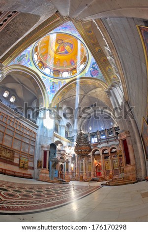 Jerusalem - September 3: Hall of the Holy Sepulchre in September 3, 2012 in Jerusalem.  Gorgeous huge marble hall in the Holy Sepulchre lit bright sun. On the walls paintings on biblical themes.