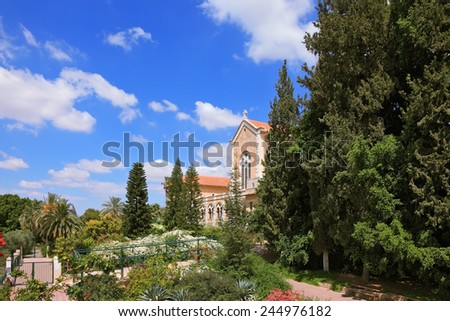 Israel.  The Trappist monastery - Latrun.  The magnificent building of the temple is surrounded by a lush garden