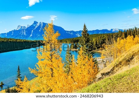 Similar – Image, Stock Photo Rocky mountains surrounding rippling sea under cloudy sky