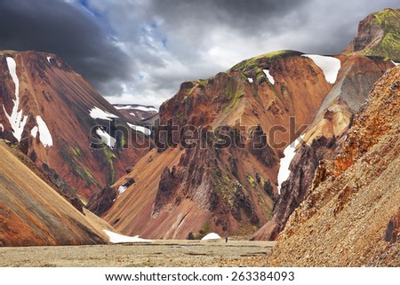 Multicolored rhyolite mountains with the remnants of last year\'s snow in July. The famous Valley Landmannalaugar in Iceland