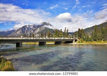 The bridge through the river and road to northern Canadian reserve Banff
