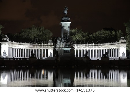 Silver fires of celebratory illumination of a colonnade in the Madrid park
