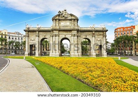 Magnificent flower beds before the Royal Triumphal arch in Madrid