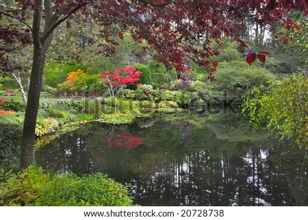Lake and trees in well-known gardens Butchart Gardens on island Vancouver