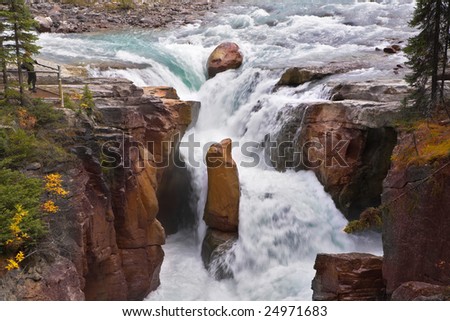 A falls in a narrow and deep canyon in the north of Canada