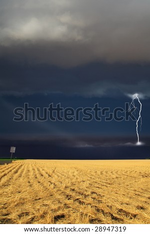 Strong thunder-storm above the oblique  fields
