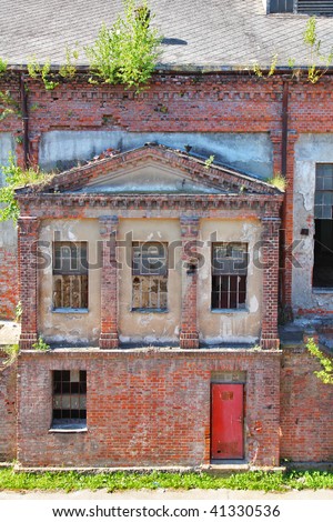 Facade of the thrown factory in the East Europe