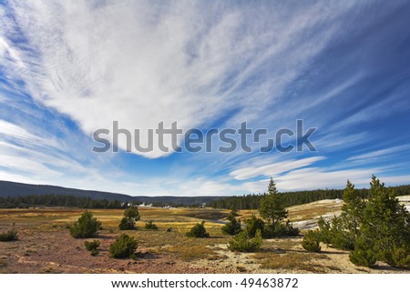 Flying clouds above meadows and woods of the most well-known park in the world Yellowstone national park