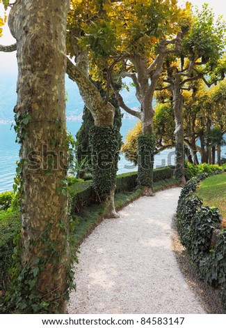 Magnificent park at the Italian villa-museum Balbyanello. Lake Como in the misty haze