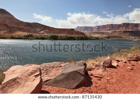 A reservation of Indians of the Navajo, the USA. Magnificent cold water the river Colorado in abrupt coast from red sandstone