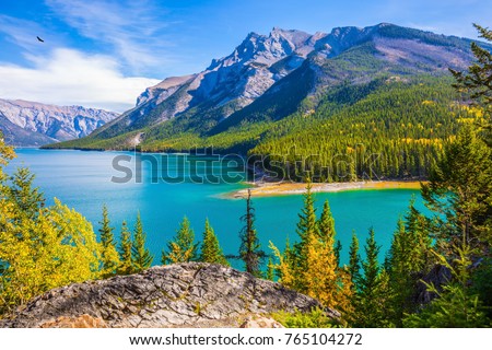 Similar – Image, Stock Photo Rocky mountains surrounding rippling sea under cloudy sky