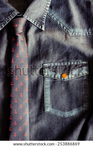 Detail of denim vintage shirt with nice tie