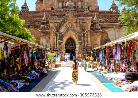 Bagan, Myanmar - June 30, 2015: Tourists and local people in front of old temple in Bagan, Myanmar in June 2015