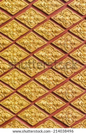 flower pattern in traditional Thai style art on wall of the temple