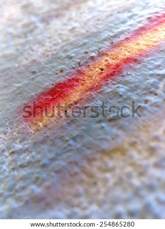 Grey wall with yellow and red detail, Shallow Depth of Field - colourful abstract background