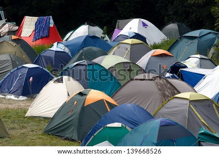 Many tents at a festival campsite