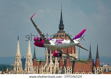 BUDAPEST, HUNGARY - MAY 1: Wizzair Airbus A320 performing a low pass over river Danube as part of the May 1 celebration of 2014.
