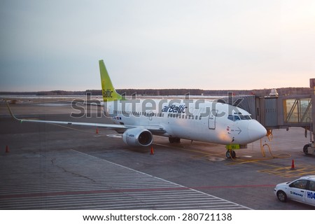 RIGA, LATVIA - MARCH 5: Air Baltic Boeing 737 airliner at Riga airport, March 5th 2014. Air Baltic is the Latvian flag carrier airline.