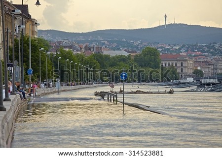 BUDAPEST, HUNGARY - JUNE 6: People at the flooding river Danube, June 6th 2013. Record breaking water level is expected in a few days.