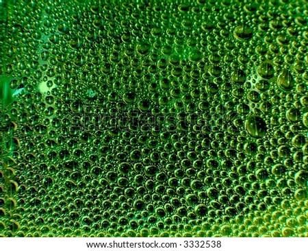 Closeup of many small green bubbles