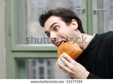 Man eating with a funny expression