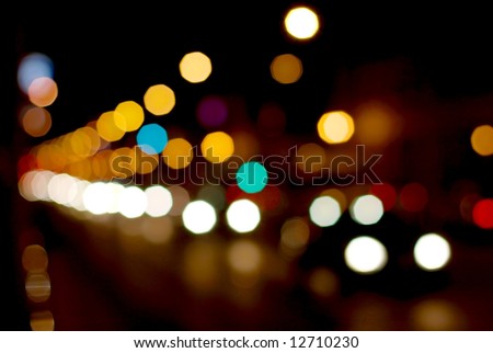 Out of focus light of traffic on a street at night