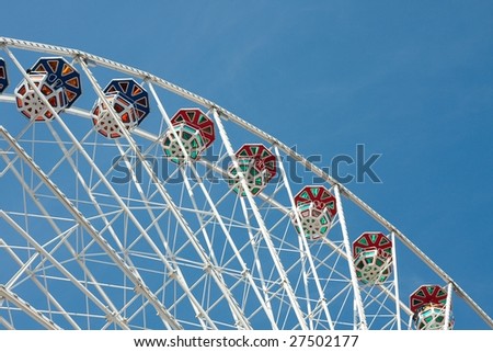 Tall observation wheel in an amusement park