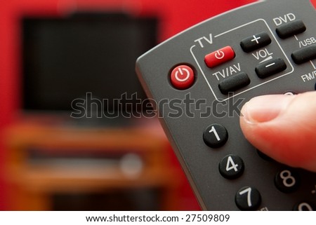 stock-photo-using-the-remote-controller-of-a-tv-27509809.jpg