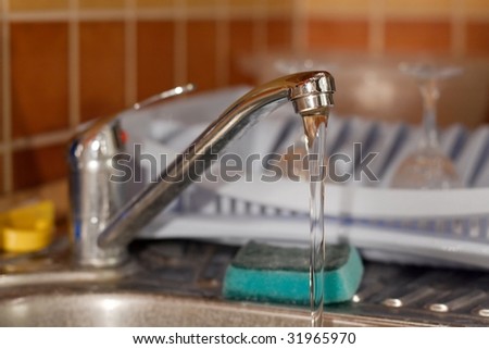Water flowing from a kitchen tap