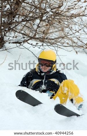Female skier coming down a wild slope with deep snow