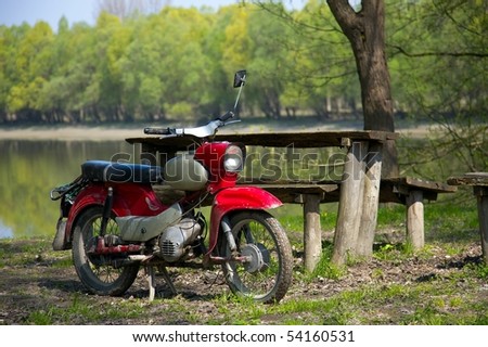 Old, vintage, generic motorbike in the countryside