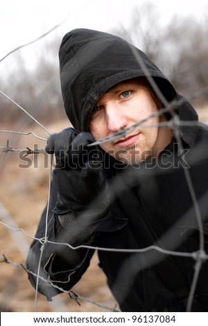Hooded man outdoor portrait