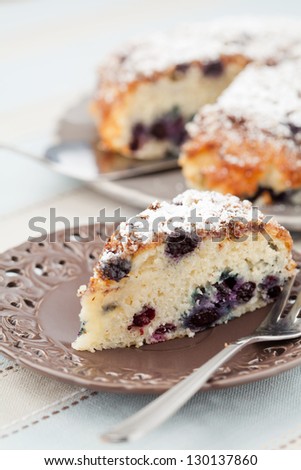 Piece of blueberry cake on serving plate