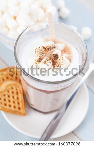 Hot chocolate made of milk and chocolate pop with grilled marshmallows