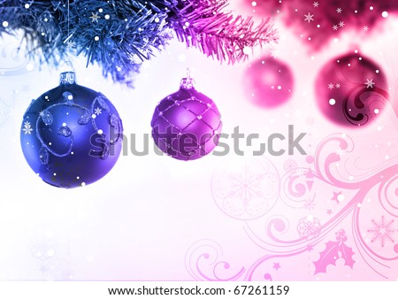 Colourful christmas baubles hanging from a tree.