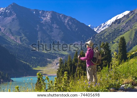 An elderly woman in the mountains.