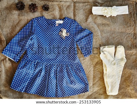 Baby dotted dress. Eco clothes. baby girl clothes. Baby girl clothes composition.