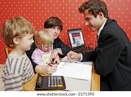Bank manager with mother and her two children  wanting a loan