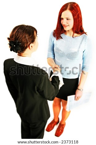 two young woman shake hands in work environment-isolated on white