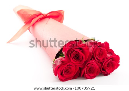 Paper wrapped red rose bouquet on white background