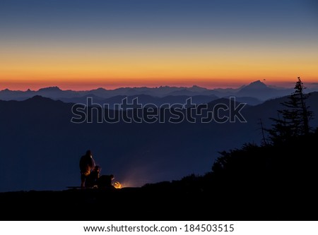 NIght time camping on a mountain top with a beautiful sunset view