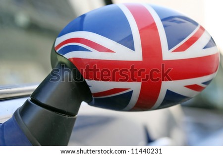 Wing mirror close-up of a car with British flag