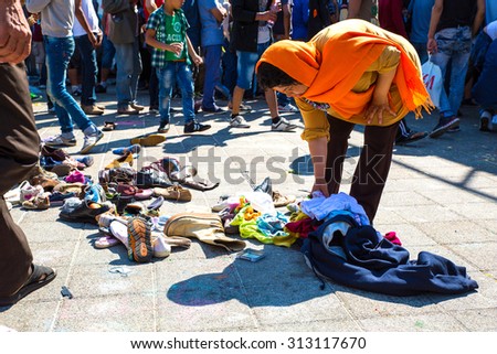 BUDAPEST, HUNGARY - SEPTEMBER 04: Refugees select donated shoes at the eastern Train Station Keleti Palyudvar on September 04, 2015 in Budapest, Hungary.