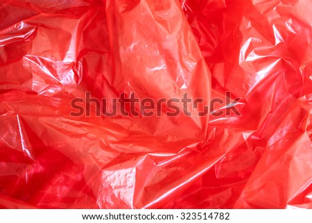 A background of red plastic foil.