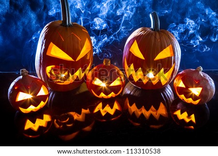 Smoking group Halloween pumpkins on marble table