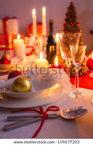 Cutlery with red ribbon on the holiday table