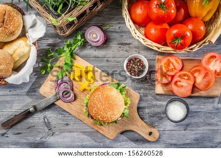 Similar – Image, Stock Photo homemade hamburgers on rustic wood