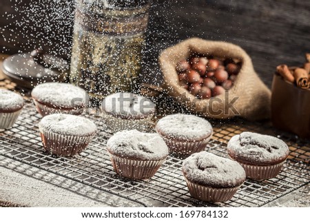 Similar – Image, Stock Photo Person sprinkling icing sugar over on cookies