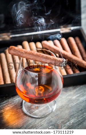 Taste and aroma of cognac and cigar