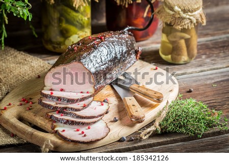 Pantry with mortars, smoked ham and  herbs